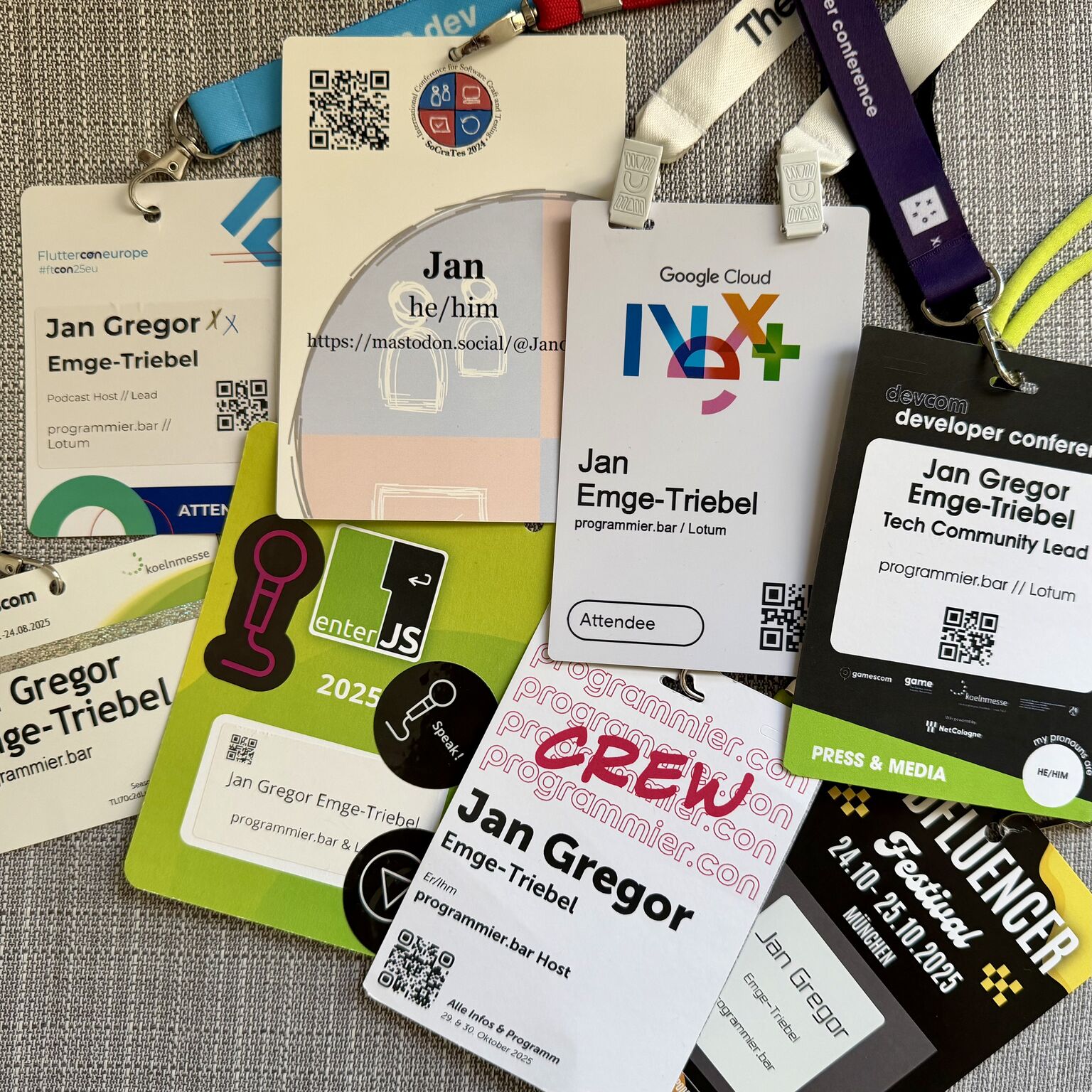 Some of my conference badges from 2025