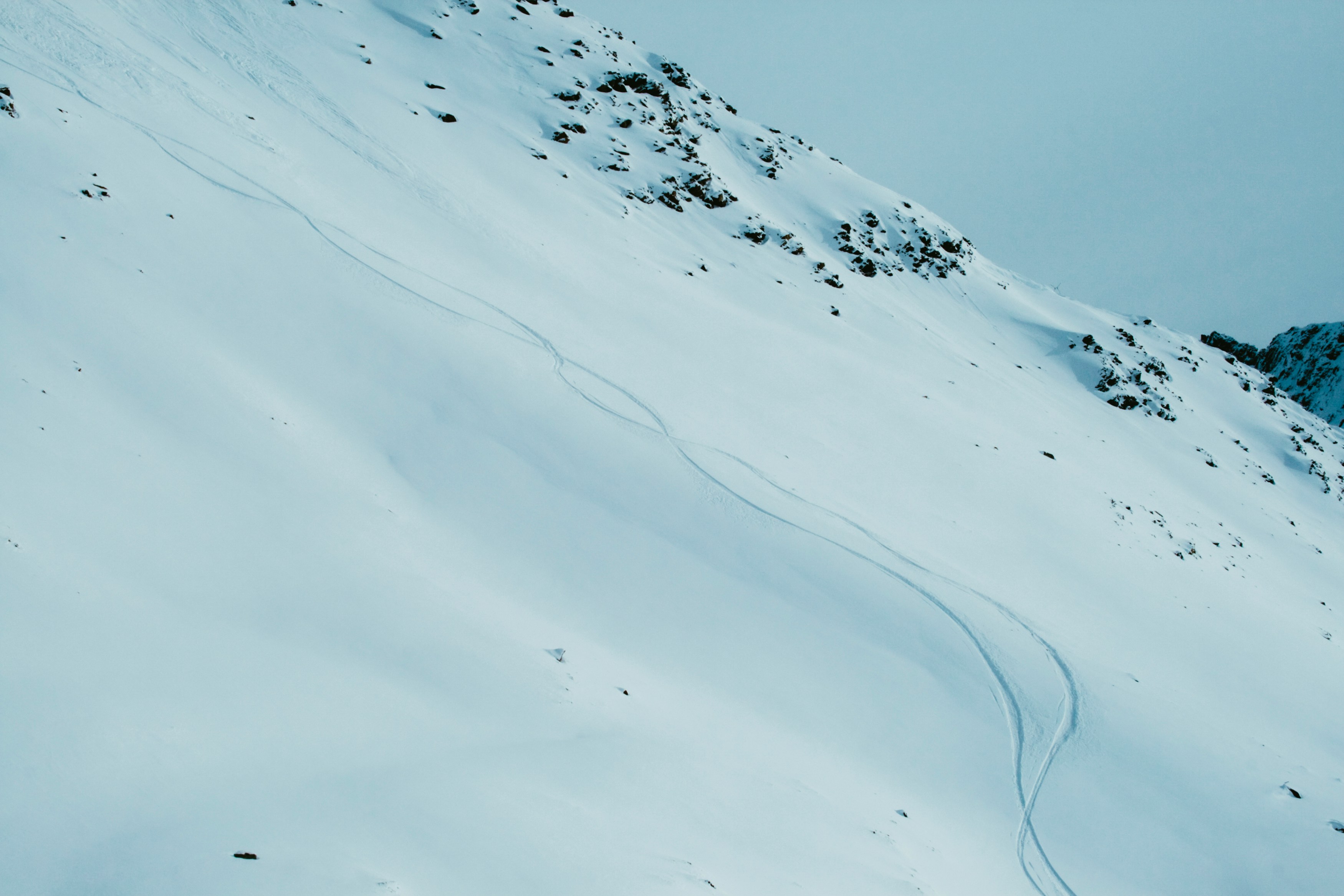 A very lonely but slippery slope on a snowy mountain.